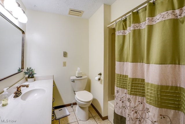 bathroom with visible vents, toilet, a textured ceiling, vanity, and tile patterned flooring