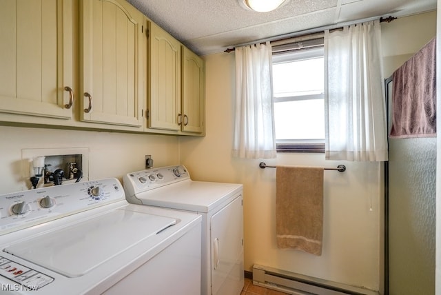 washroom featuring cabinet space, a baseboard radiator, and separate washer and dryer