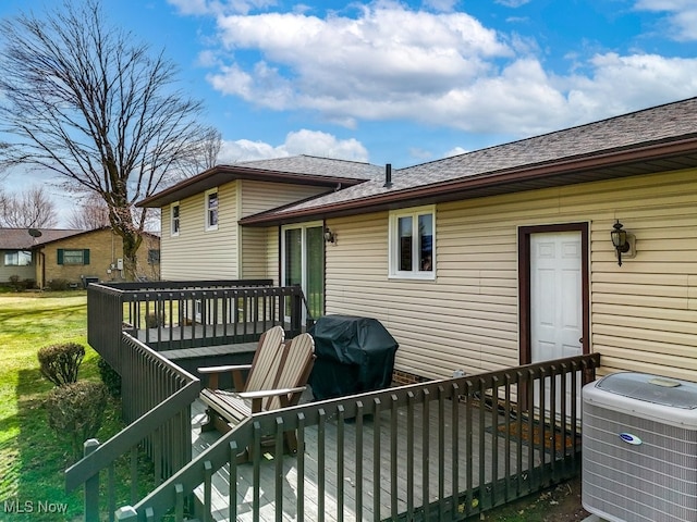 wooden deck featuring grilling area and central AC