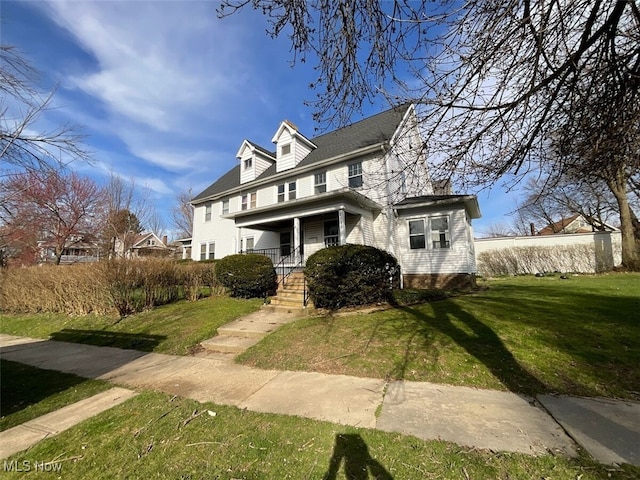 3096 Meadowbrook Blvd, Cleveland Heights, OH 44118 - view of front of house featuring covered porch and a front lawn