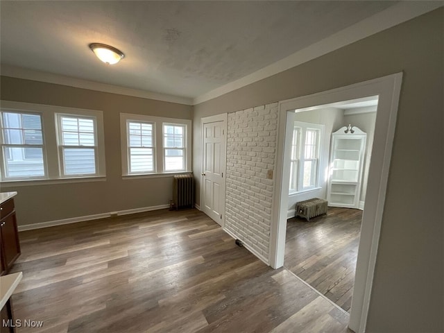 3096 Meadowbrook Blvd, Cleveland Heights, OH 44118 - spare room featuring crown molding, dark wood-type flooring, baseboards, and radiator