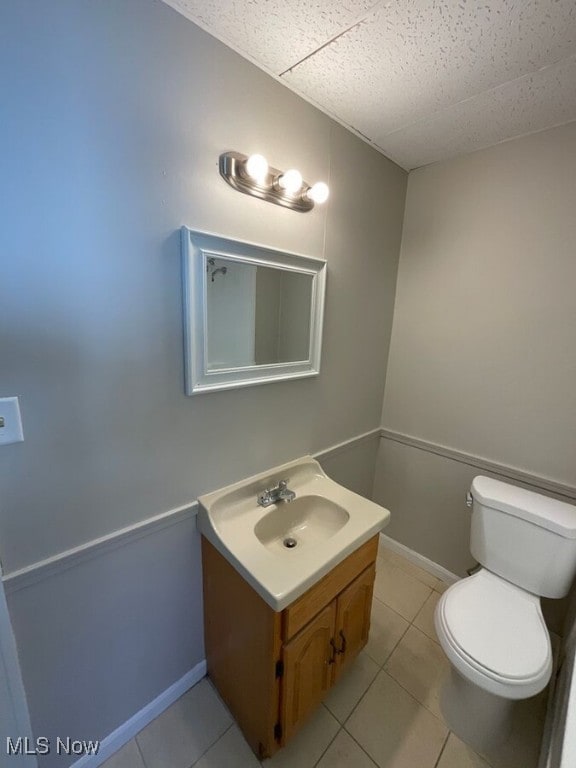 3096 Meadowbrook Blvd, Cleveland Heights, OH 44118 - half bathroom featuring a paneled ceiling, vanity, toilet, and baseboards