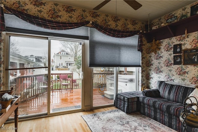 1518 Washington Ave, Parkersburg, WV 26101 - living area featuring wood finished floors, a ceiling fan, and wallpapered walls