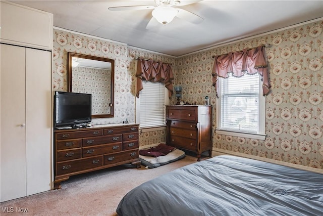 1518 Washington Ave, Parkersburg, WV 26101 - bedroom featuring a closet, light colored carpet, a ceiling fan, baseboards, and wallpapered walls