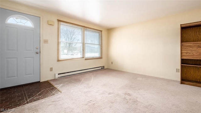 carpeted entrance foyer with plenty of natural light, a baseboard radiator, and baseboards