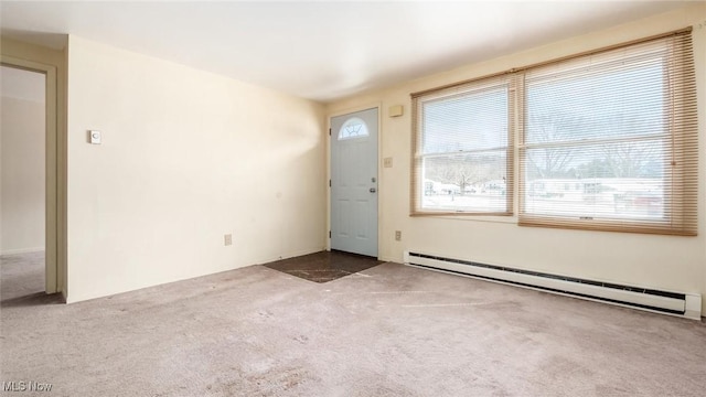 interior space featuring carpet flooring and baseboard heating