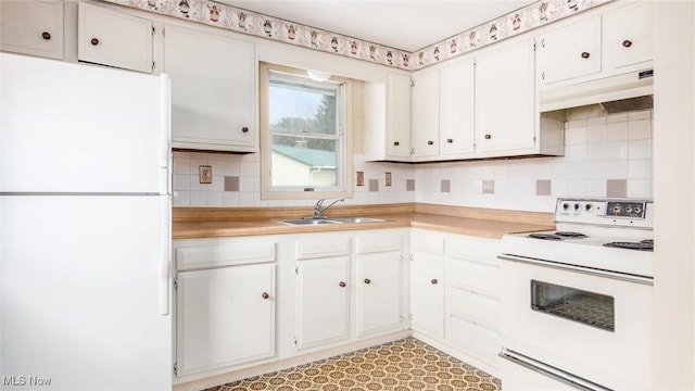 kitchen featuring tasteful backsplash, light countertops, a sink, white appliances, and under cabinet range hood