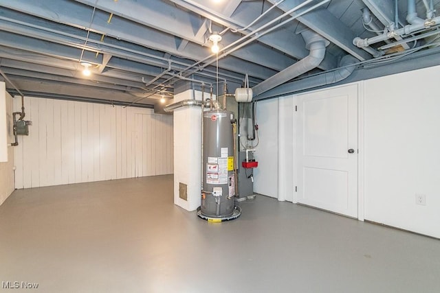 unfinished basement with gas water heater