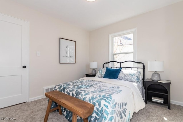 bedroom featuring carpet flooring, visible vents, and baseboards