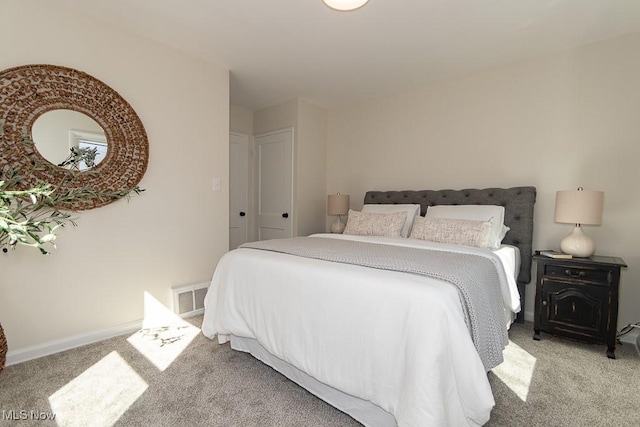 bedroom featuring carpet, visible vents, and baseboards