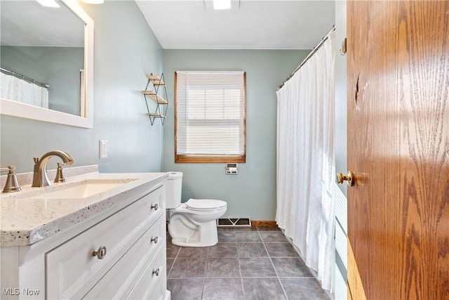 full bathroom with tile patterned flooring, visible vents, vanity, and toilet