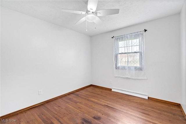 unfurnished room with a baseboard radiator, baseboards, ceiling fan, and wood finished floors