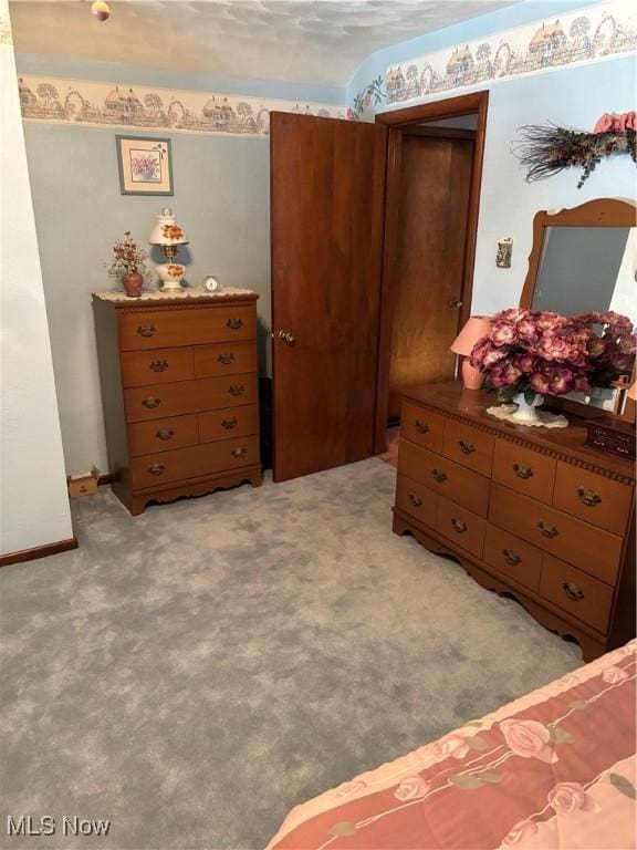 bedroom featuring light carpet