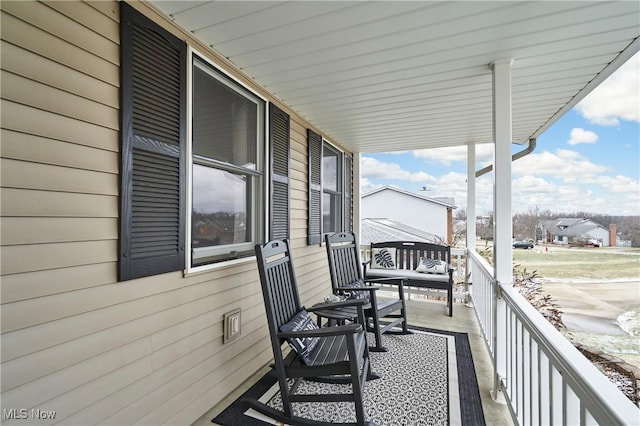 balcony featuring a porch