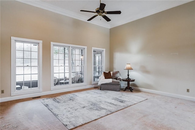 living area featuring ornamental molding, visible vents, carpet floors, and baseboards