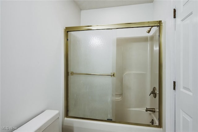 full bathroom featuring enclosed tub / shower combo and toilet