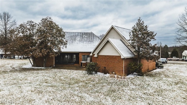 view of front of home with brick siding