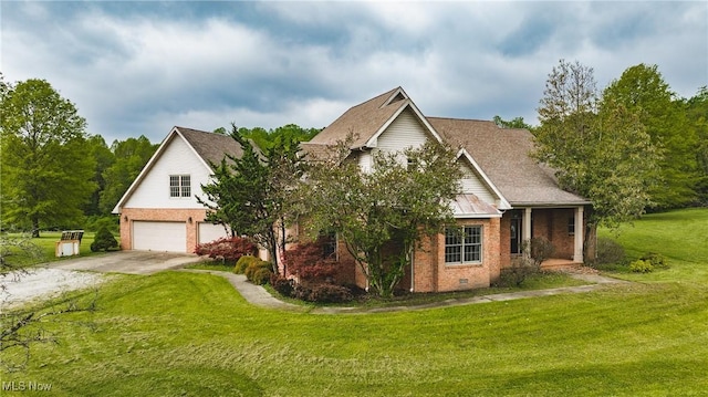 1003 Duncan Ln, Parkersburg, WV 26104 - traditional-style home featuring a garage, concrete driveway, a front yard, and brick siding