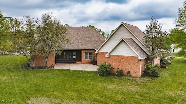 1003 Duncan Ln, Parkersburg, WV 26104 - back of house featuring a lawn, brick siding, and a patio area