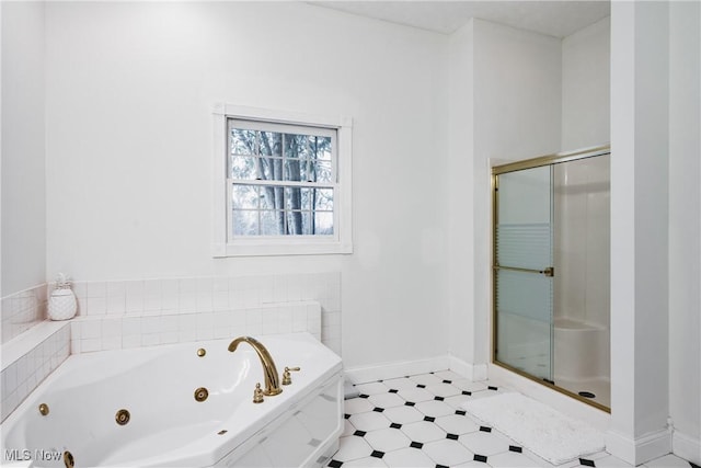 1003 Duncan Ln, Parkersburg, WV 26104 - bathroom featuring a jetted tub, baseboards, a shower stall, and tile patterned floors