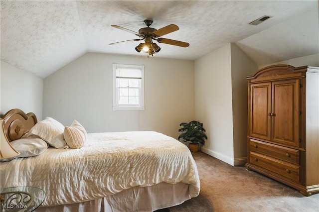 1003 Duncan Ln, Parkersburg, WV 26104 - bedroom with visible vents, light carpet, baseboards, a textured ceiling, and vaulted ceiling