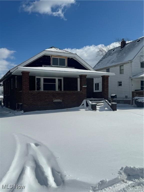 view of front of house featuring brick siding