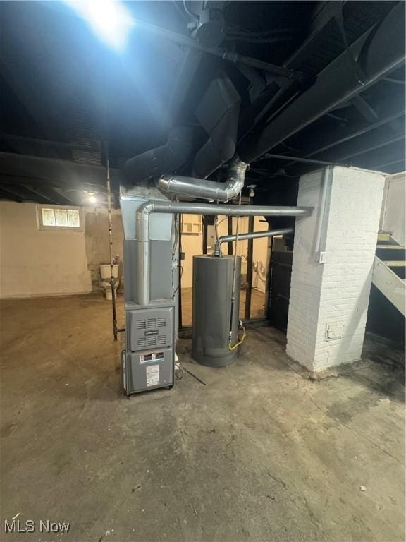 basement with gas water heater and heating unit