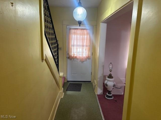 13705 Graham Ave, Cleveland, OH 44112 - doorway featuring stairs and baseboards