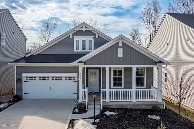 view of front of property featuring driveway, an attached garage, a porch, and a shingled roof