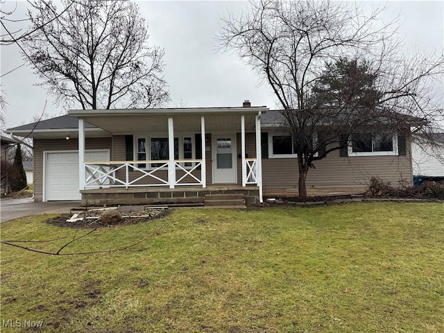 view of front of home with driveway, a porch, a front lawn, and an attached garage