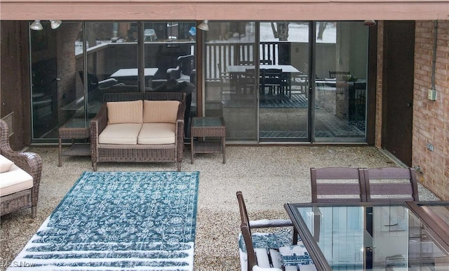 exterior space featuring a patio area and outdoor lounge area