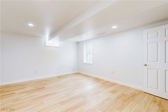 basement with recessed lighting, light wood-style flooring, and baseboards