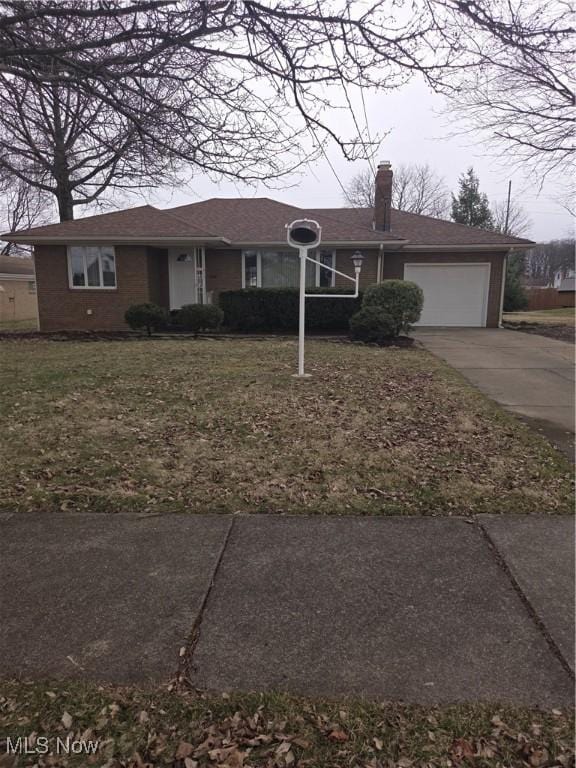 single story home with an attached garage, brick siding, concrete driveway, a front lawn, and a chimney