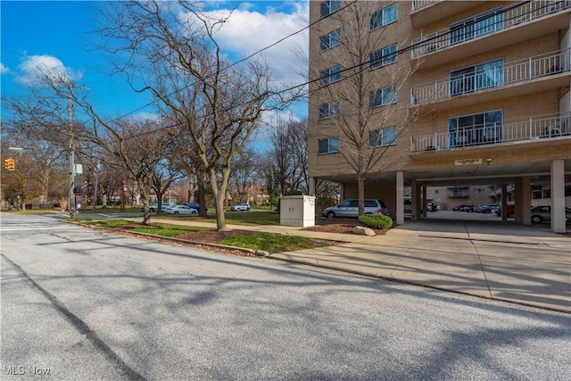 exterior space featuring curbs and sidewalks