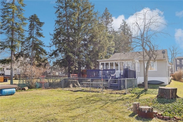 view of yard featuring a sunroom and fence