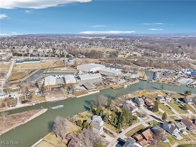 birds eye view of property featuring a residential view and a water view