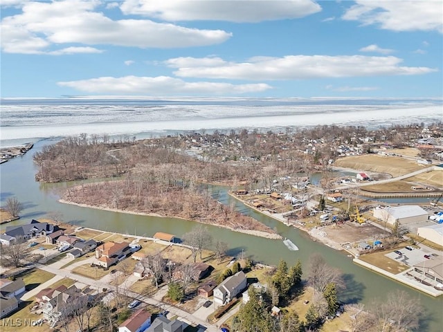 birds eye view of property with a water view and a residential view