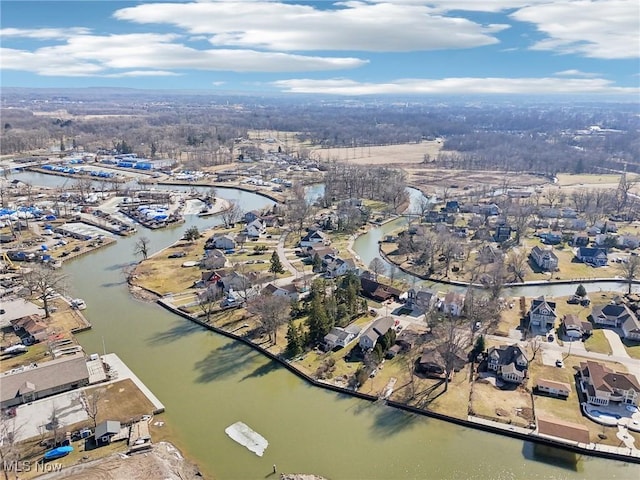 birds eye view of property featuring a water view and a residential view