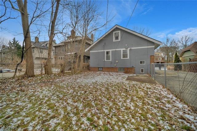 back of property featuring a fenced backyard