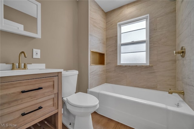 full bathroom with wood finished floors, vanity, toilet, and bathing tub / shower combination