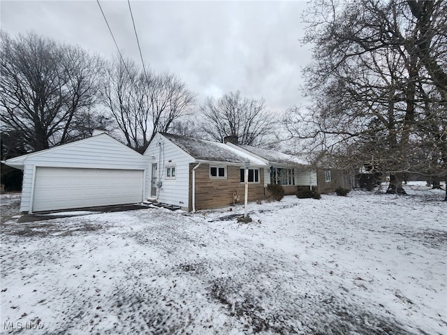 exterior space with a detached garage