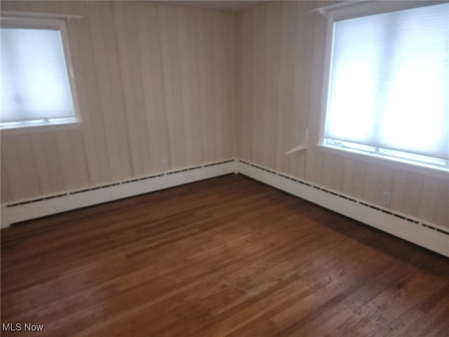 empty room featuring wood finished floors