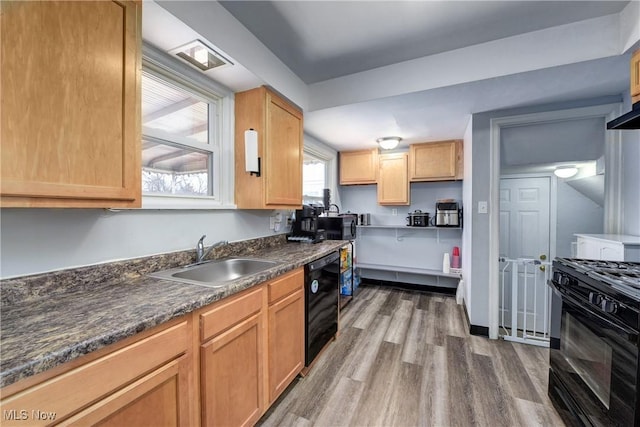 kitchen with wine cooler, dark countertops, black gas range, a sink, and wood finished floors