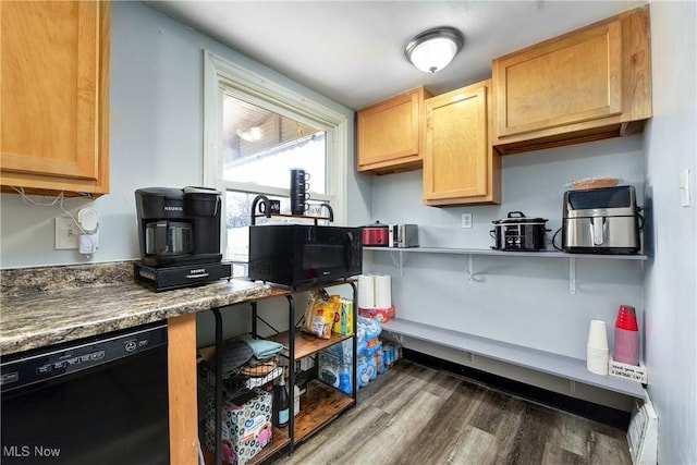 kitchen featuring black appliances and dark wood-type flooring