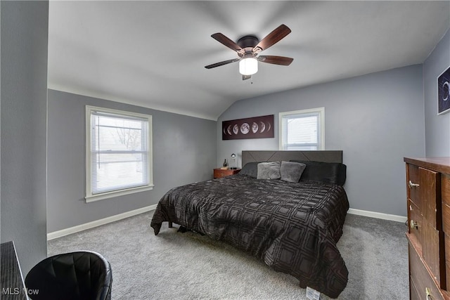 carpeted bedroom featuring vaulted ceiling, ceiling fan, and baseboards