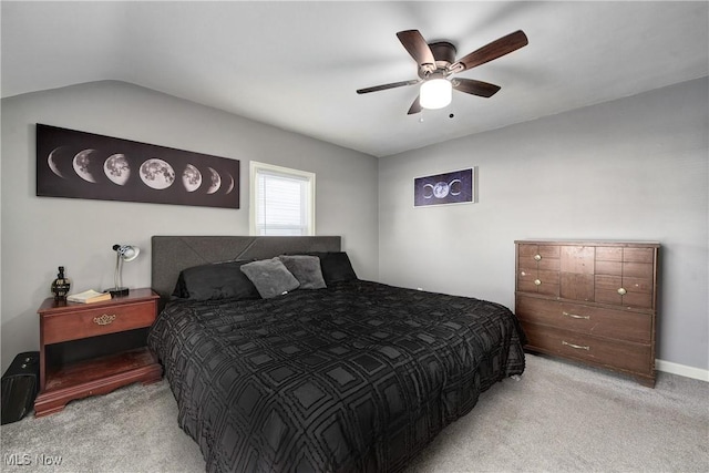 bedroom with light carpet, ceiling fan, and lofted ceiling