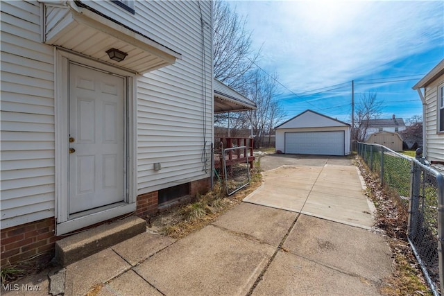 exterior space with a garage and fence