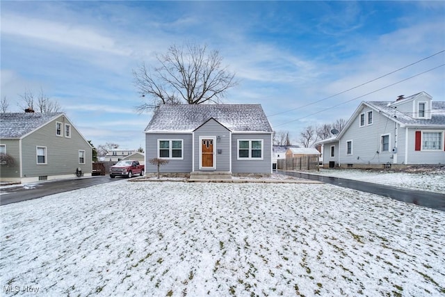 bungalow with a shingled roof