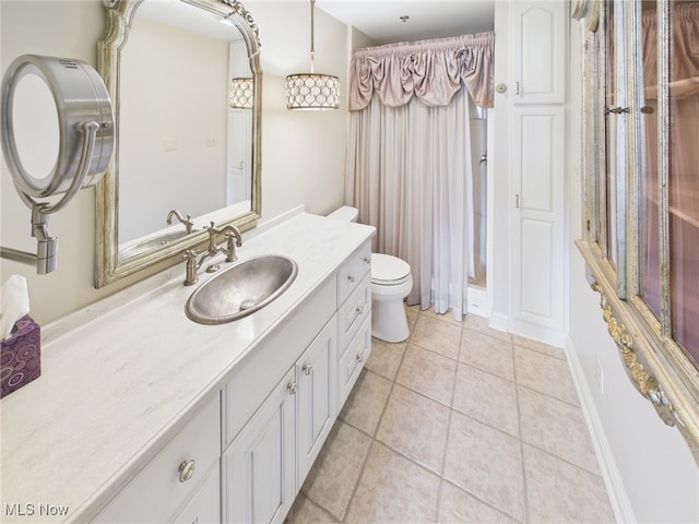 full bathroom featuring baseboards, toilet, curtained shower, tile patterned flooring, and vanity