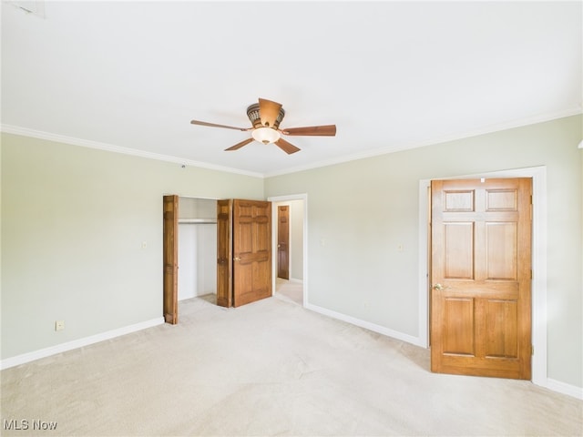 unfurnished bedroom featuring baseboards and crown molding